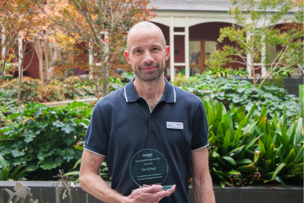 Picture of Kev holding the award