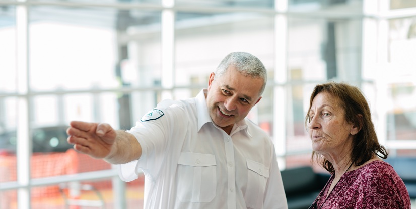Security officer providing directions to a visitor