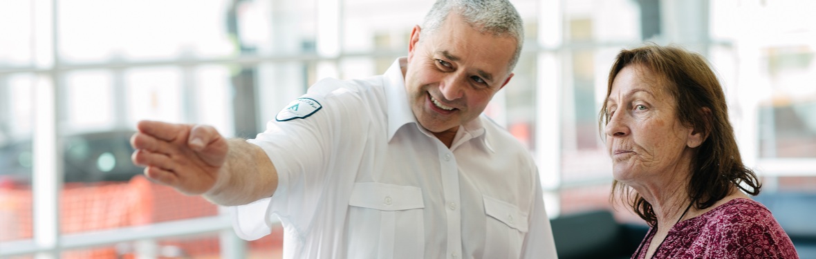 Security officer providing directions to a visitor