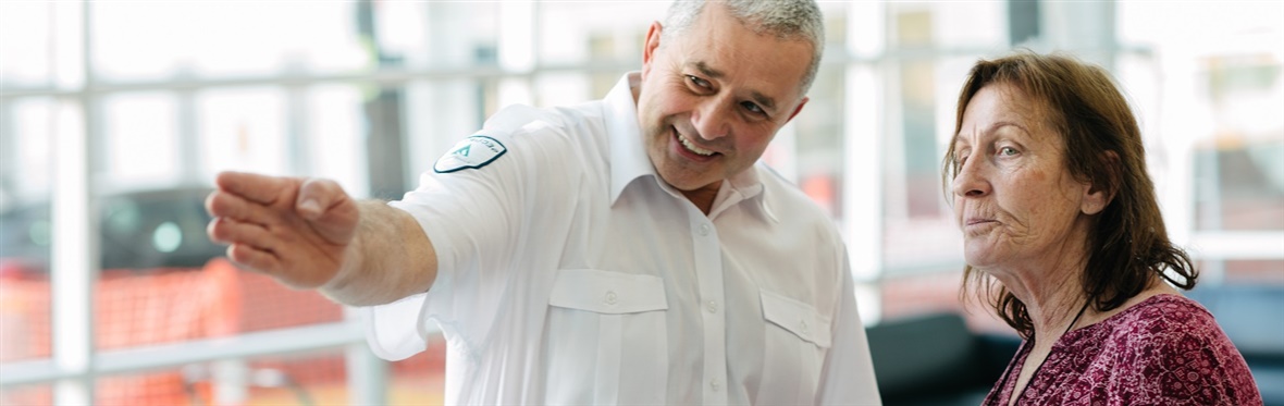Security officer providing directions to a visitor